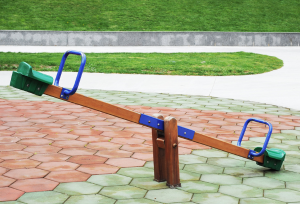 An image of a seesaw in a playground